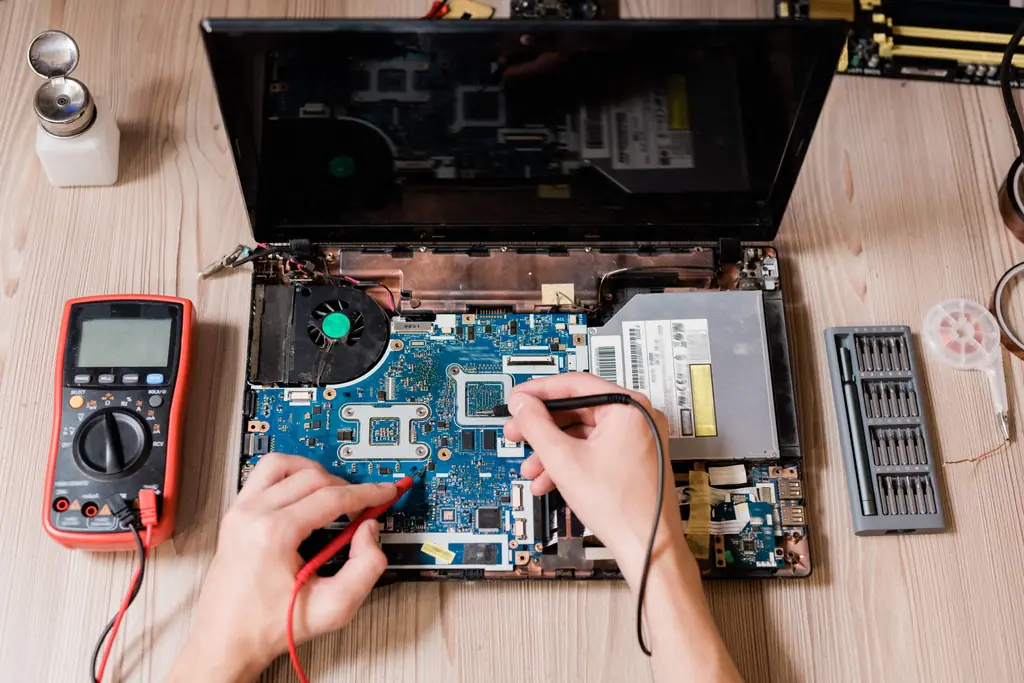 Testing a laptop motherboard with a multimeter