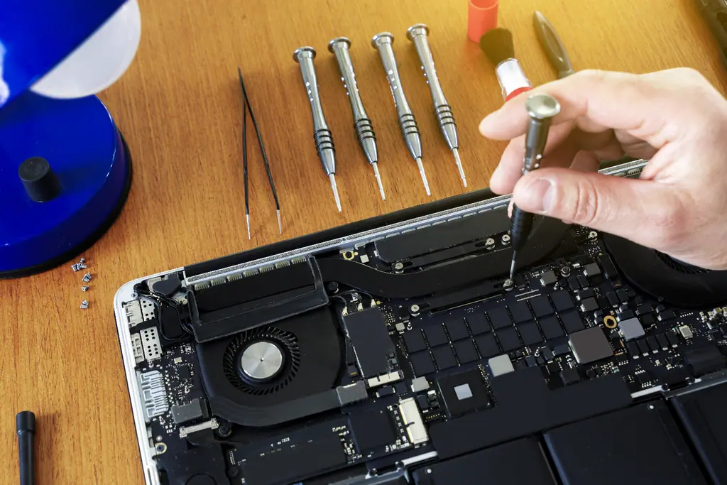 MacBook repair tools on the bench